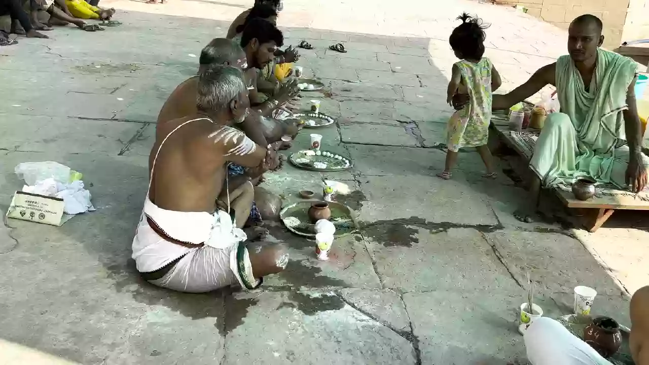  Image of Family doing pind daan near the ghats-Your First Pitrupaksha