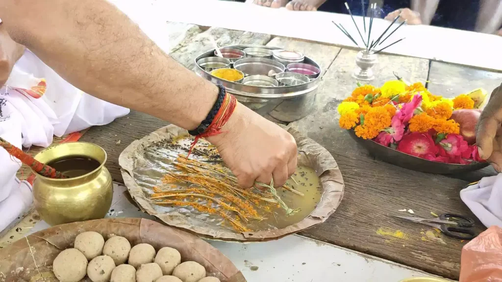 Performing Shradh rituals with Kusha grass, water, and Pindas (rice balls)- Vishwadevas in Shradh